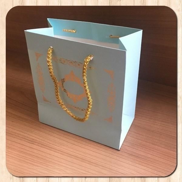 15.5x17x8 Ölçülü Mavi Üzerine Gold Saray Desenli Karton Çanta