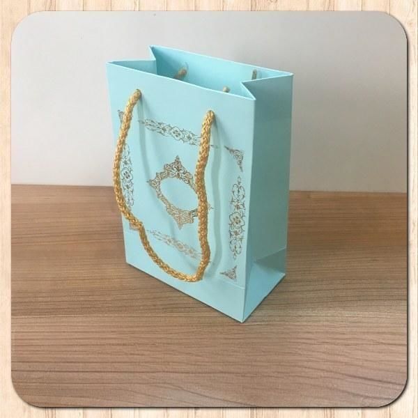 12x17x7 Ölçülü Mavi Üzerine Gold Saray Desenli Karton Çanta
